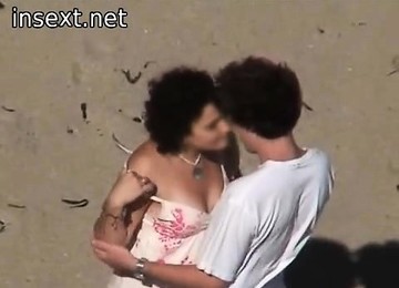 Couple In The Beach Making Love