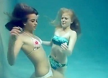 Two Girls Breath Holding And Posing Underwater