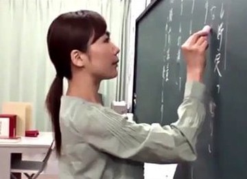 Japanese Teacher Gives A Valuable Lesson At The Blackboard