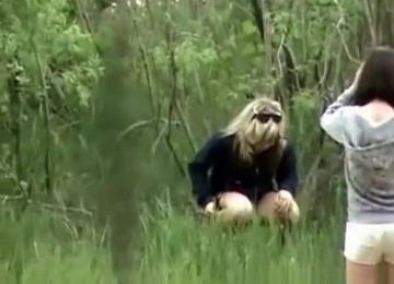 Woman And Friend Peeing Outdoors