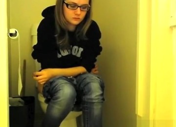 Girl In Glasses Pees In Bathroom Toilet
