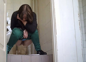 Redhead Chick In Green Pants Pisses In The Public Restroom