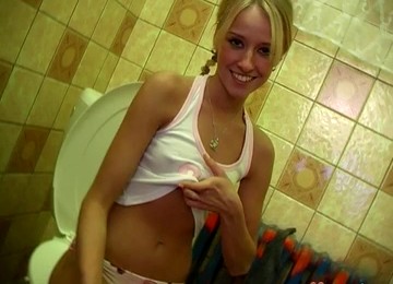 A Blonde With Pigtails Sneaks Into The Bathroom With Her Toy