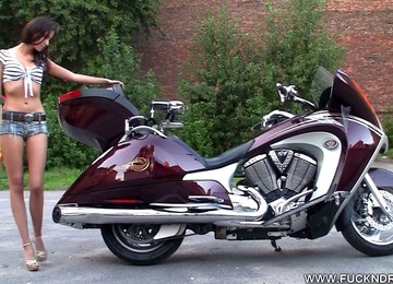 Hot Chick On A Motorcycle Strips And Plays With Her Tight Pussy