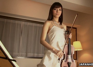 Lovely And Horny Japanese Cutie Teases Her Pussy With A Violin Bow